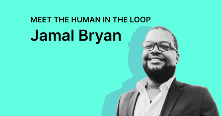A black-and-white photo of Jamal Bryan smiling on a teal background.