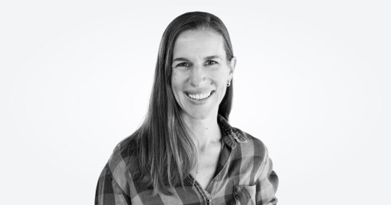 A black-and-white photograph of Erin Palm, MD, Infinitus's medical lead.