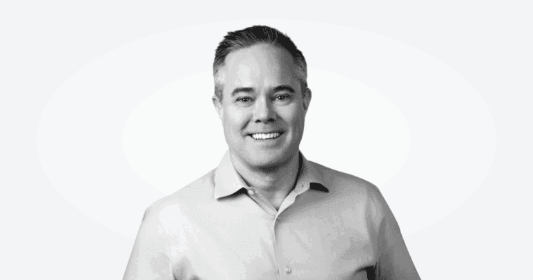 A black-and-white photograph of Andrew Burns, Infinitus commercial lead.